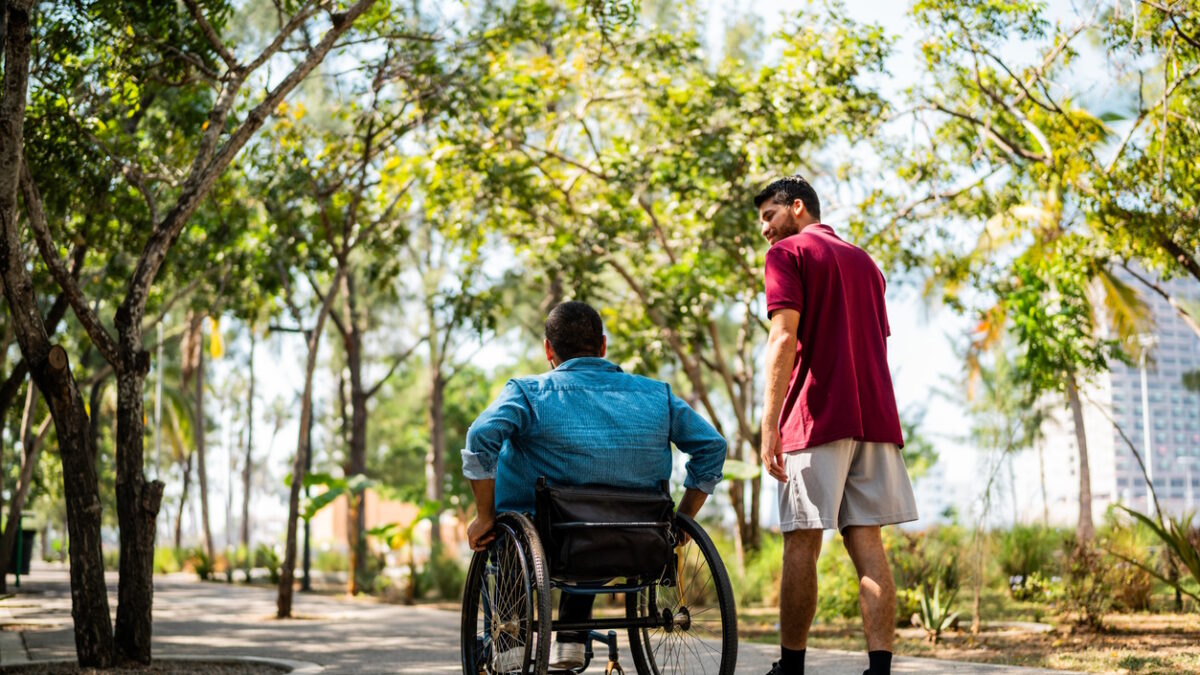 Friends talking and walking on public park