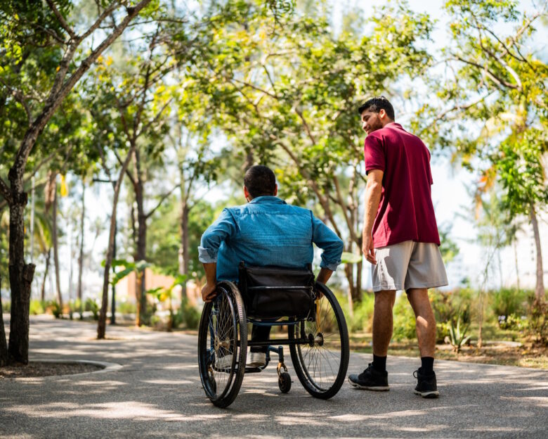 Friends talking and walking on public park