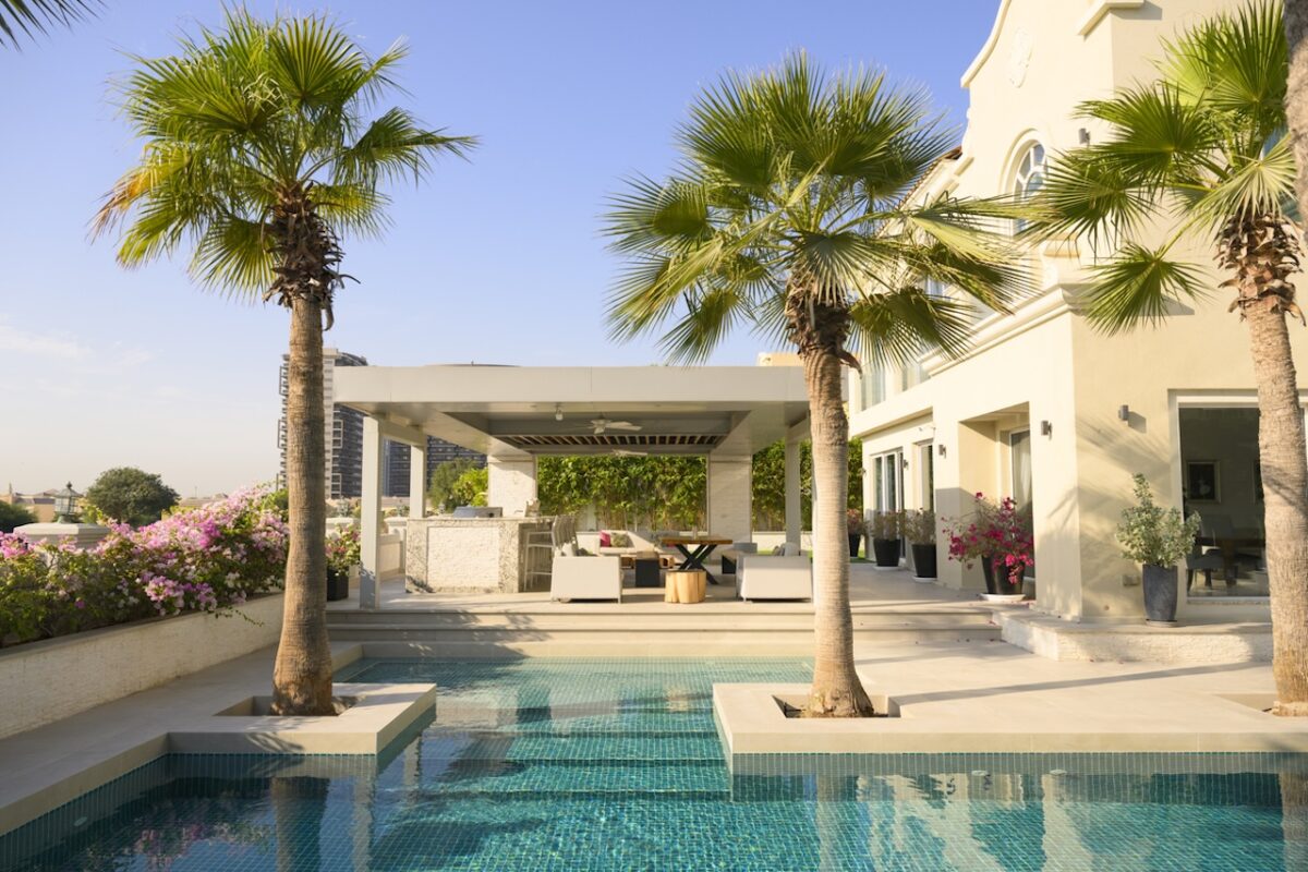 Beautiful luxury villa with swimming pool and palm trees in Dubai, United Arab Emirates
