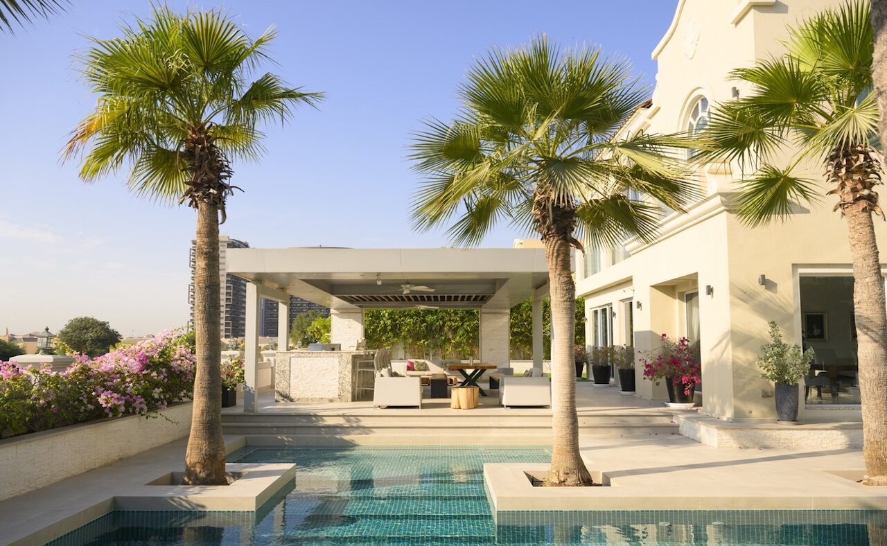 Beautiful luxury villa with swimming pool and palm trees in Dubai, United Arab Emirates