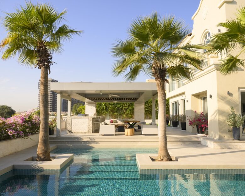 Beautiful luxury villa with swimming pool and palm trees in Dubai, United Arab Emirates
