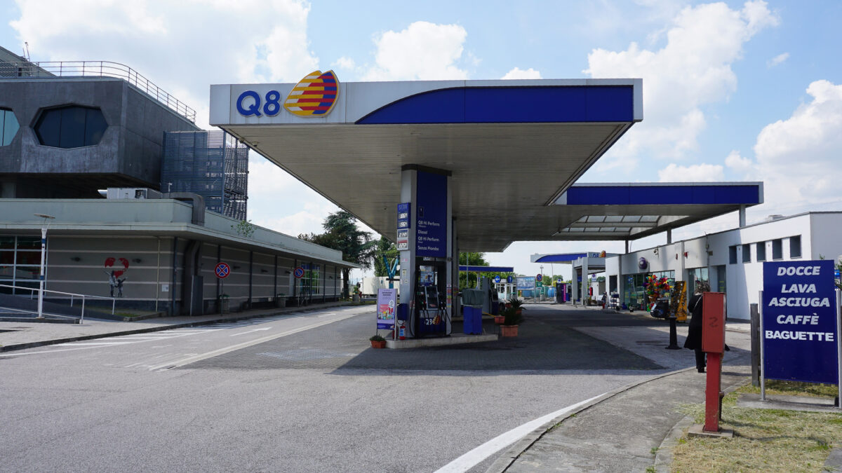 OSTUNI, ITALY - May 11, 2025: The banner of Q8 gas station with prices of gasoline and diesel fuel displayed on highway