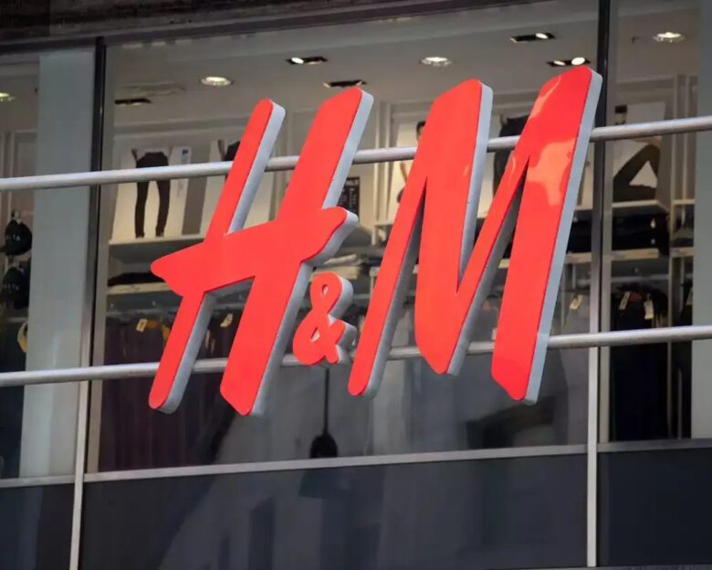 Close up of the logo for the H&M store in Milan, Italy. H&M is a Swedish clothing company with over 2,200 stores worldwide.
