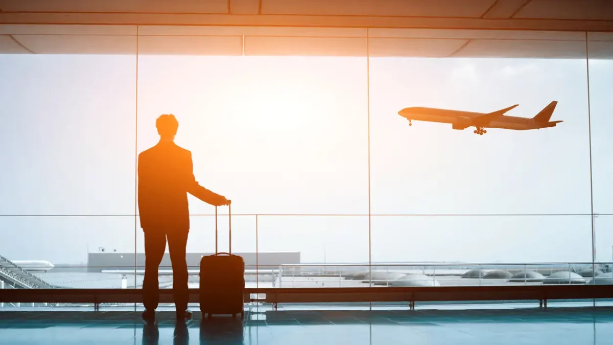 business man with luggage waiting in the airport