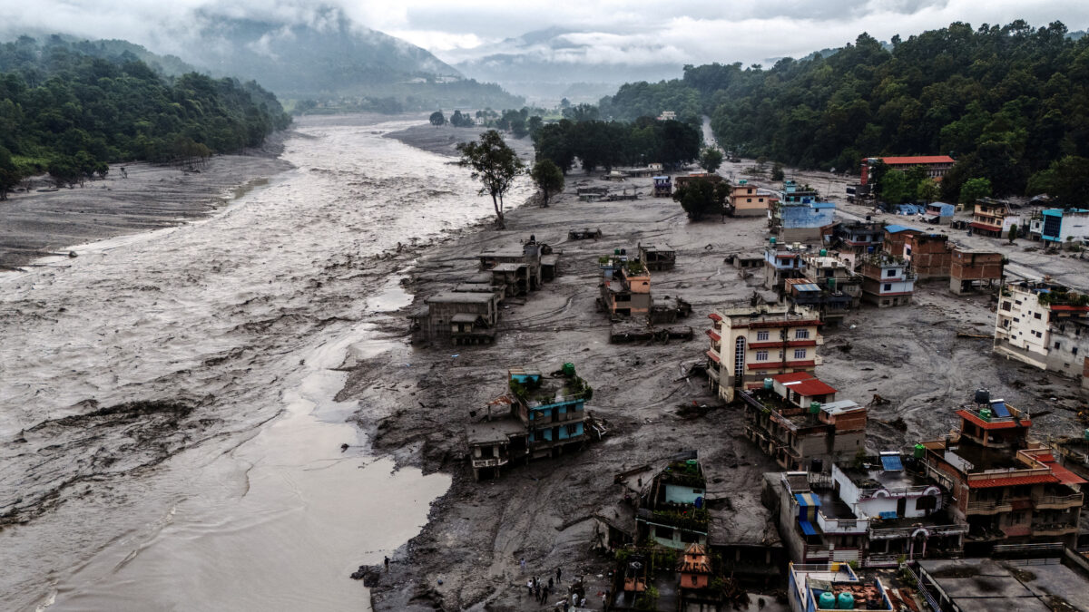 FILE PHOTO: A drone view shows damaged buildings and houses covered in mud next to the Likhu River following deadly flash floods and mudslides, in Devighat, Nuwakot district, Nepal, August 30, 2026. REUTERS/Athit Perawongmetha/File Photo