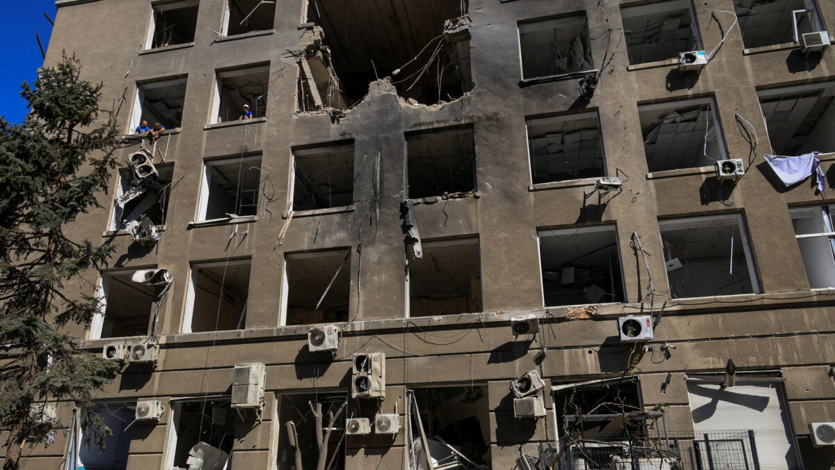 A worker removes debris in front of a building of a business centre hit by a Russian drone strike, amid Russia's attack on Ukraine, in Odesa, Ukraine September 2, 2026. REUTERS/Nina Liashonok