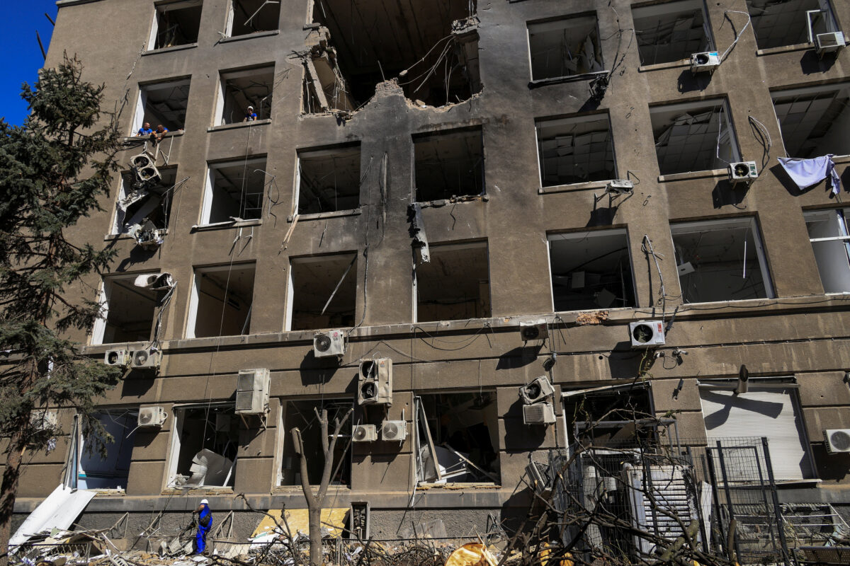A worker removes debris in front of a building of a business centre hit by a Russian drone strike, amid Russia's attack on Ukraine, in Odesa, Ukraine September 2, 2026. REUTERS/Nina Liashonok