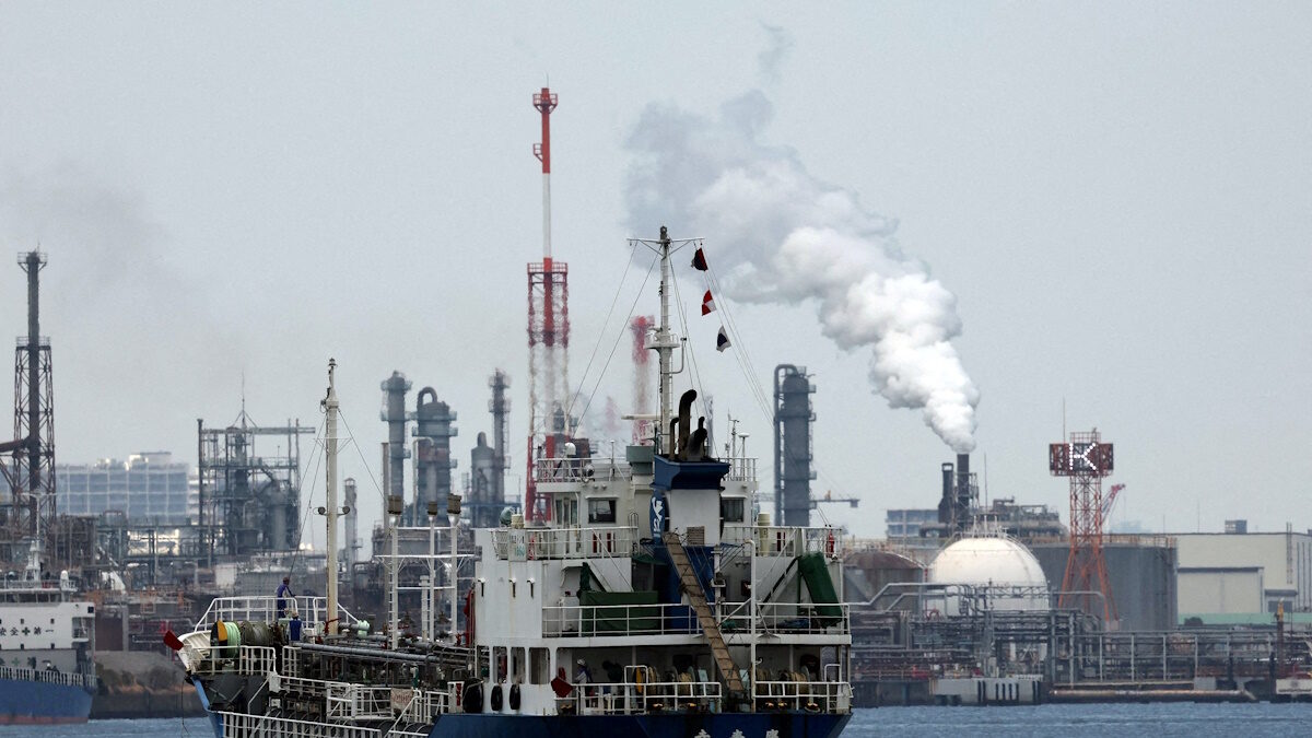 FILE PHOTO: A small tanker sails near an oil refinery, in the Keihin Industrial Zone in Kawasaki, south of Tokyo, Japan March 17, 2026.