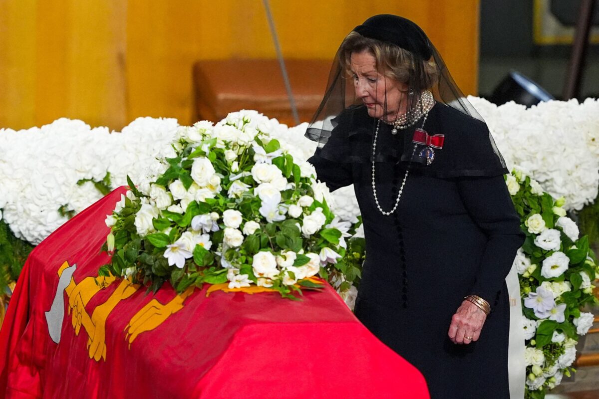 Norway's Queen Sonja places a rose on the coffin during the funeral ceremony of Norway's King Harald at Oslo Cathedral, in Oslo, Norway, September 9, 2026. NTB