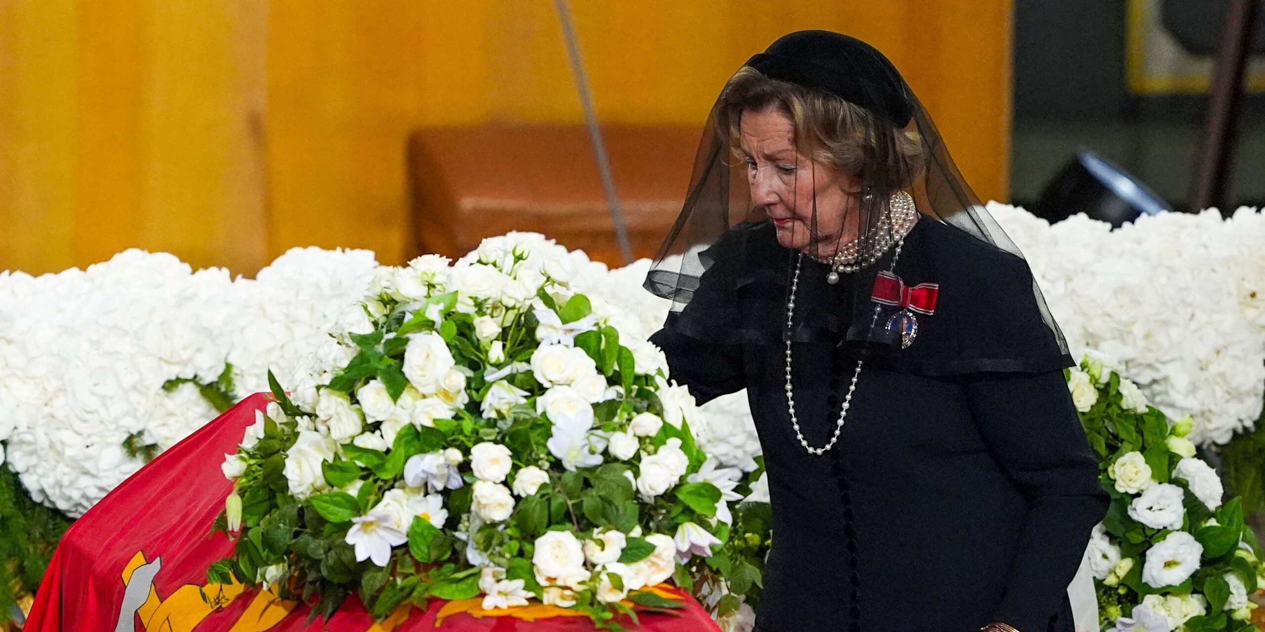 Norway's Queen Sonja places a rose on the coffin during the funeral ceremony of Norway's King Harald at Oslo Cathedral, in Oslo, Norway, September 9, 2026. NTB