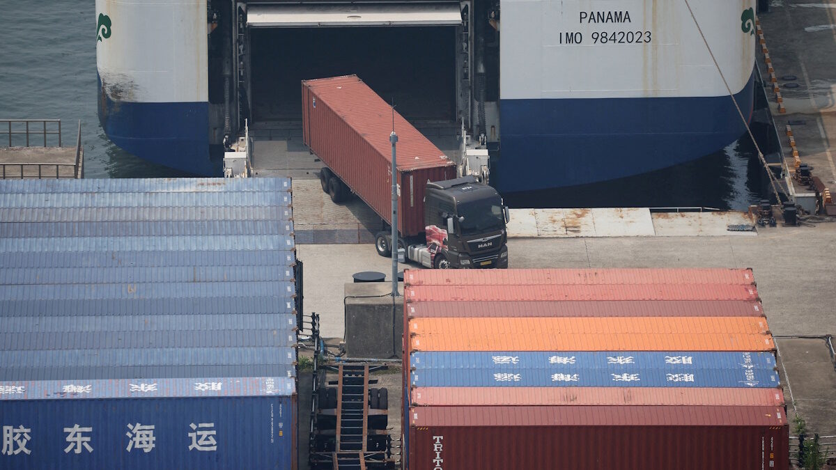 FILE PHOTO: A truck unloads a shipping container at Pyeongtaek port in Pyeongtaek, South Korea, July 8, 2025.