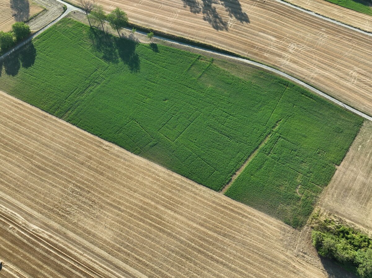 A drone view shows traces of multiple buildings with different orientations on the southern edge of the Roman city of Aventicum in Avenches, Switzerland, July 8, 2026. L. Francey, DGIP-Direction de l’archeologie cantonale