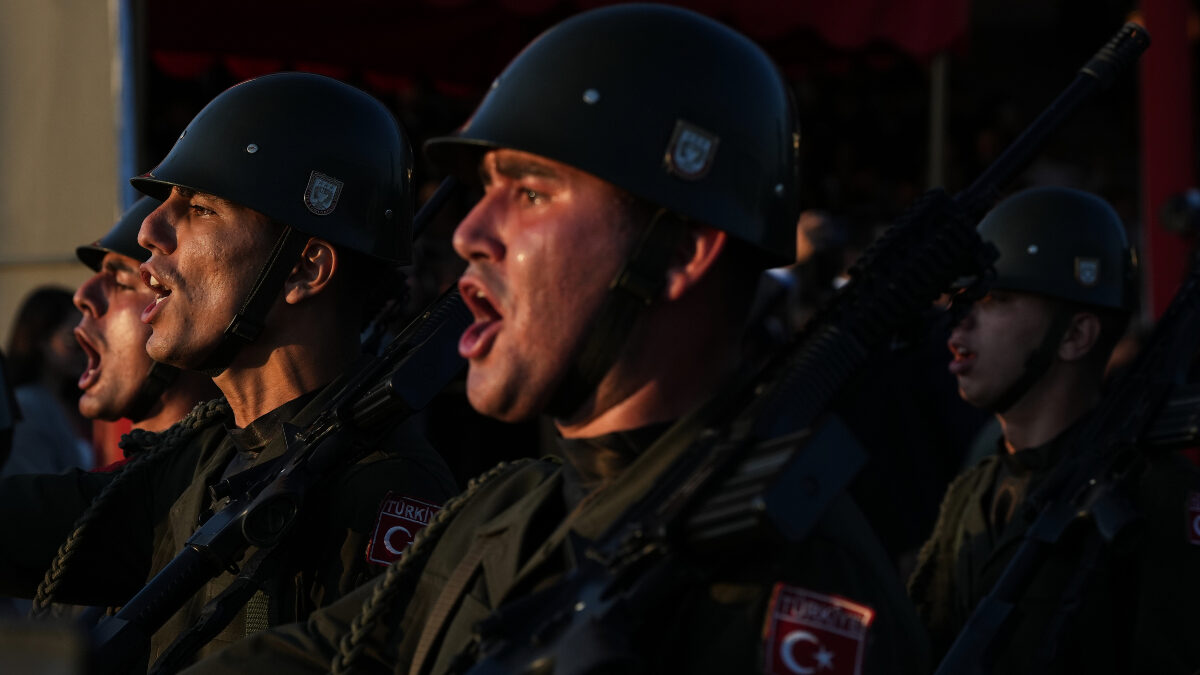 Turkish soldiers shout slogans during a military parade marking the 52nd anniversary of the 1974 Turkish invasion in the Turkish occupied area, in the divided capital of Nicosia, Cyprus, Monday, July 20, 2026.