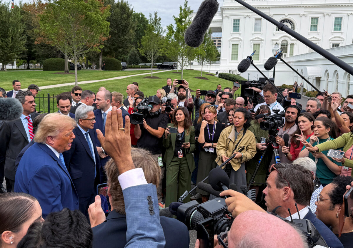 US President Donald Trump and tech leaders speak to the press at the White House driveway following a luncheon in the East Room, in Washington, D.C., US, September 29, 2026. Picture taken with a mobile phone. REUTERS