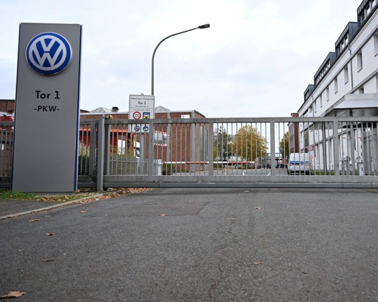 FILE PHOTO: The logo of Europe’s largest carmaker Volkswagen AG is seen at the closed Gate 1 of the Volkswagen Osnabrueck plant during a briefing of the Works Council about VW's plans to close down three plants and lay off thousands of employees in Osnabrueck, Germany, October 28, 2024.