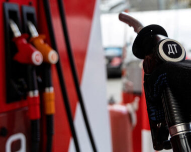 FILE PHOTO: An employee holds a diesel fuel pump nozzle at a petrol station of Neftmagistral company in Moscow, Russia, September 8, 2023.