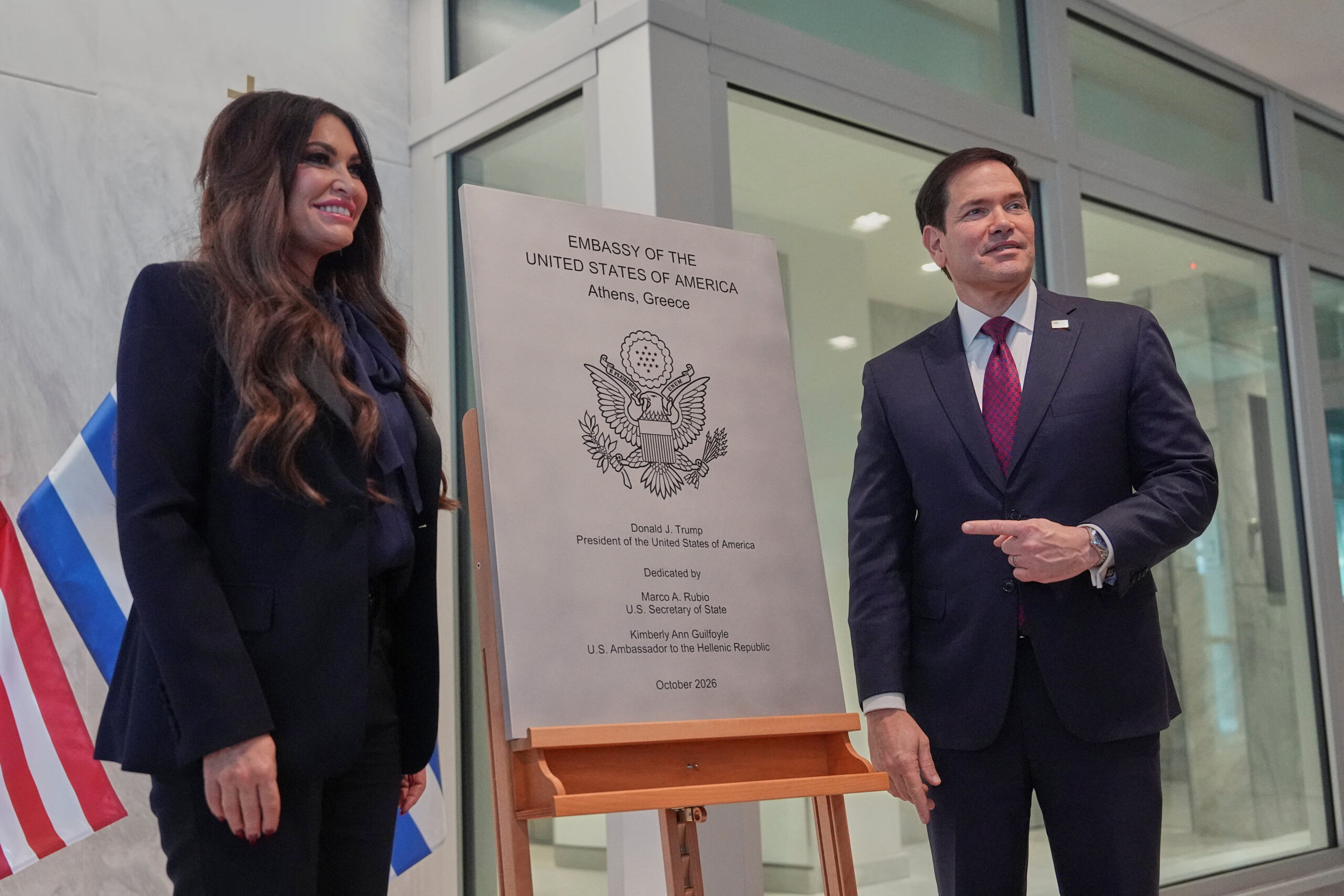 US Secretary of State Marco Rubio visits Greece U.S. Secretary of State Marco Rubio right, and U.S. Ambassador to Greece Kimberly Guilfoyle unveil a plaque during a dedication ceremony at the chancery of the U.S. Embassy, in Athens, Greece October 7, 2026. Mark Schiefelbein/Pool via REUTERS