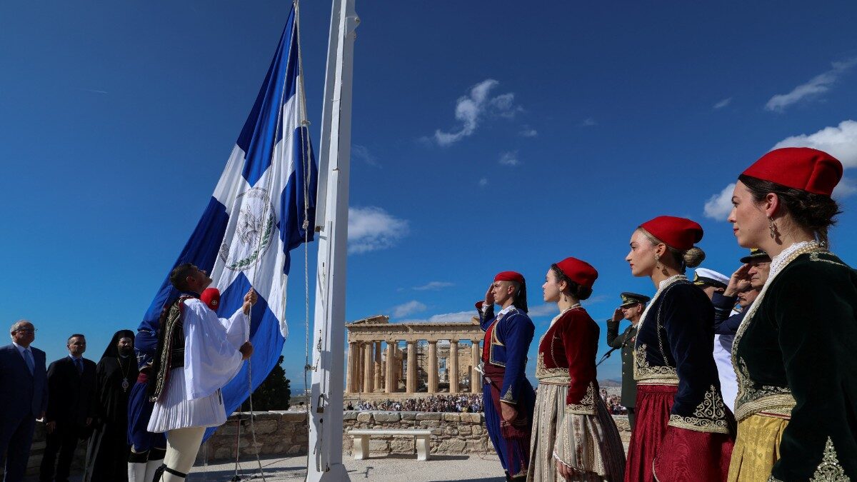 Presidential Guards stand in front of the Parthenon temple during a ceremony marking the 82nd anniversary of the liberation of Athens from Nazi occupation, atop the Acropolis hill in Athens, Greece, October 12, 2026. REUTERS/Louisa Gouliamaki