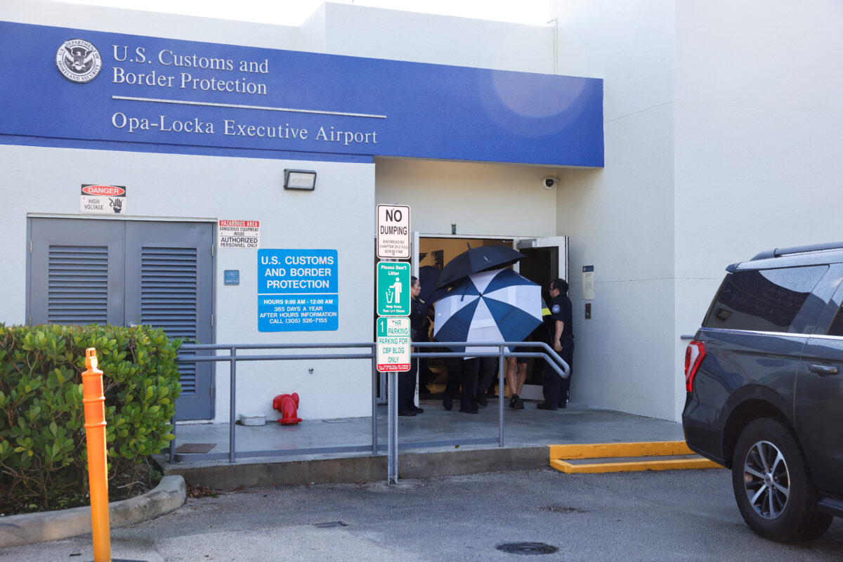 Brazilian Senator Flavio Bolsonaro is escorted from the US Customs and Border Protection facility at Opa-locka Executive Airport following his arrival in the United States, near Miami, Florida, US, October 28, 2026. REUTERS
