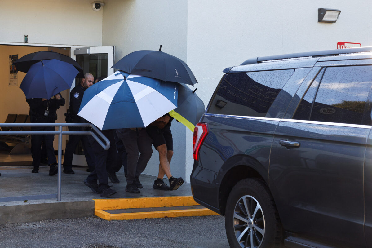 Brazilian Senator Flavio Bolsonaro is escorted from the US Customs and Border Protection facility at Opa-locka Executive Airport following his arrival in the United States, near Miami, Florida, US, October 28, 2026. REUTERS