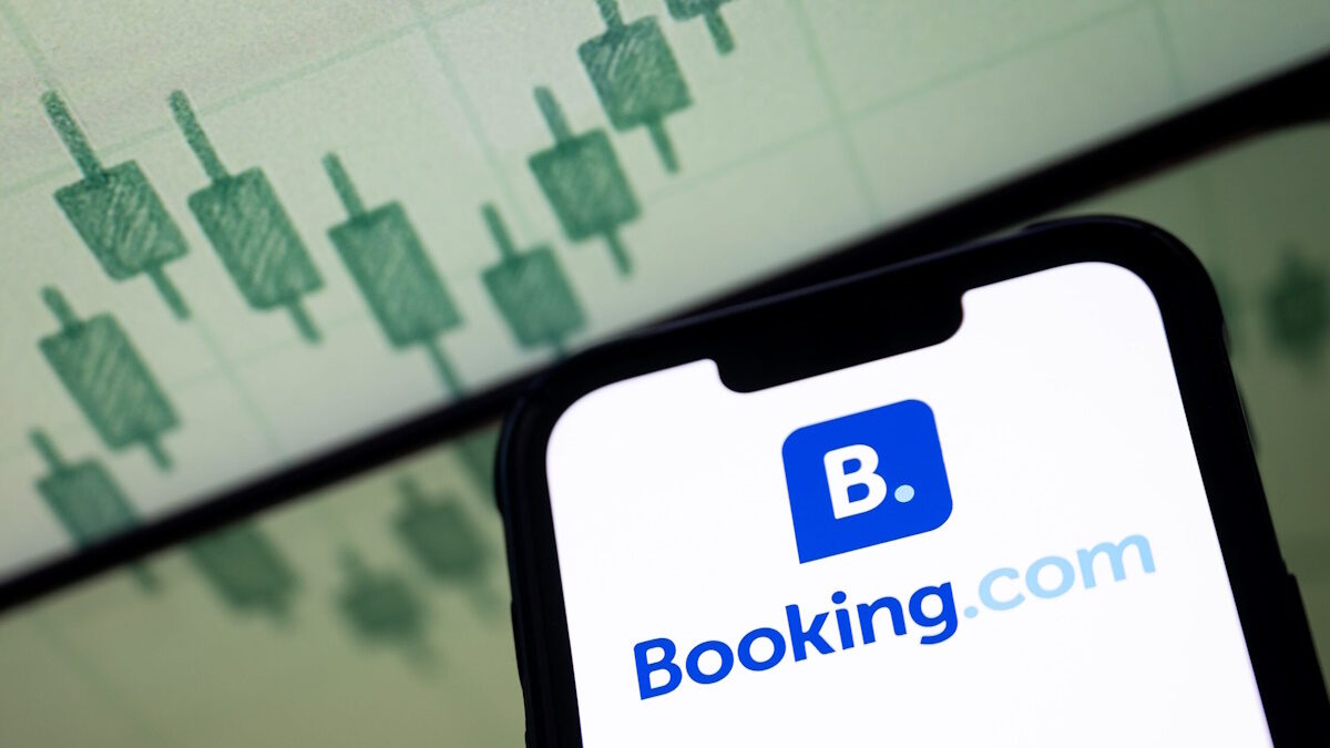 In this photo illustration, a Booking.com logo seen displayed on a smartphone screen.