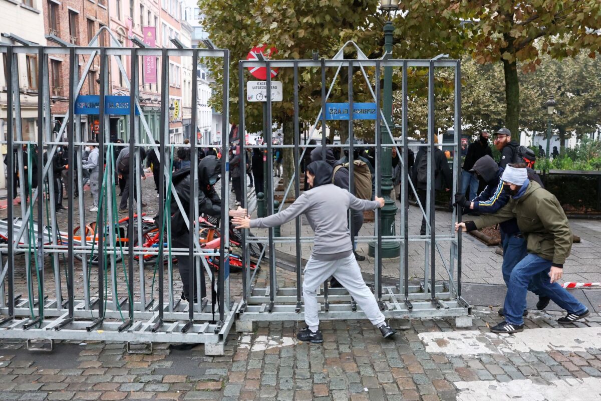 Demonstrators place a barricade on a street as student protesters join a nationwide strike against the Belgian government's austerity measures and budget cuts in Brussels, Belgium, October 9, 2026. REUTERS