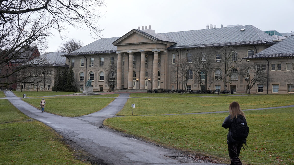 FILE - People walk on the campus of Cornell University in Ithaca, N.Y., Friday, Feb. 2, 2024.