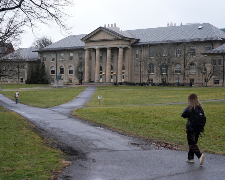 FILE - People walk on the campus of Cornell University in Ithaca, N.Y., Friday, Feb. 2, 2024.