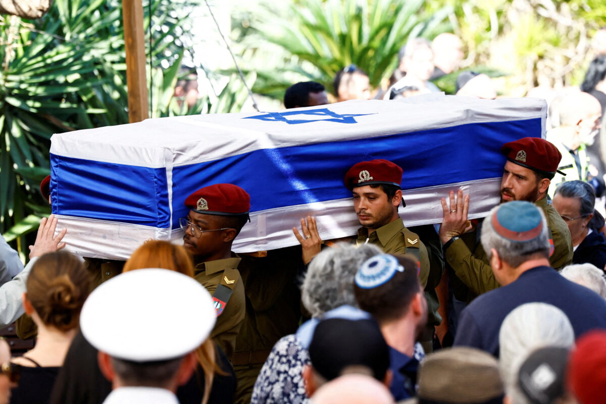 Pallbearers carry the coffin of Gal Meir Eisenkot, 25, an Israeli solider and the son of Israeli cabinet minister and former military chief Gadi Eisenkot, who was killed in northern Gaza during the ongoing ground operation by Israel's military in the Gaza Strip, during his funeral in Herzliya, Israel, December 8, 2023. REUTERS
