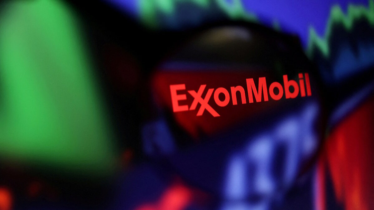 FILE PHOTO: FILE PHOTO: Exxon Mobil logo and stock graph are seen through a magnifier displayed in this illustration taken September 4, 2022