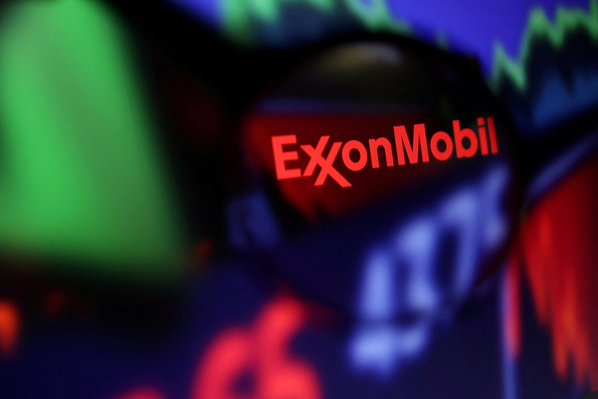 FILE PHOTO: FILE PHOTO: Exxon Mobil logo and stock graph are seen through a magnifier displayed in this illustration taken September 4, 2022
