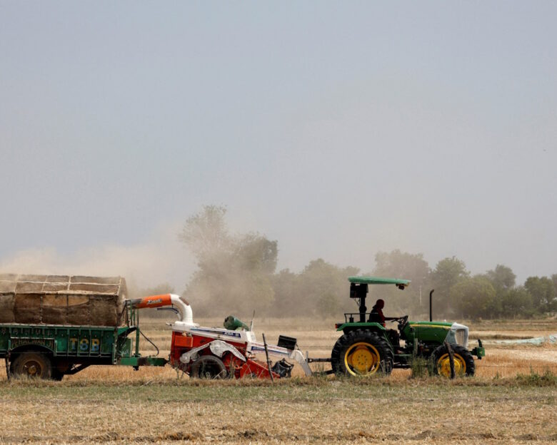FILE PHOTO: A farmer removes stubble with the help of a machine in a wheat field in Mathura, in the northern state of Uttar Pradesh, India, April 25, 2024.