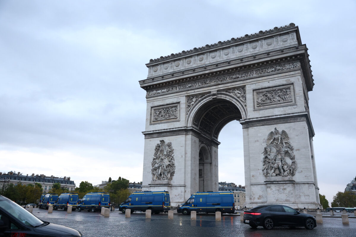French gendarmerie vans are parked in front of the Arc de Triomphe near the Champs-Elysees avenue in Paris ahead of nationwide protests called by the "Yellow Vests" movement joined by French high school and university students, against the cost of living and rising fuel prices in France, October 24, 2026. REUTERS