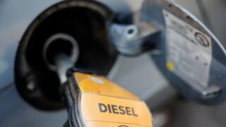 A fuel nozzle refuels a vehicle at a gas station as the German government's tax cut on fuel comes into effect, in Berlin, Germany, October 01, 2026
