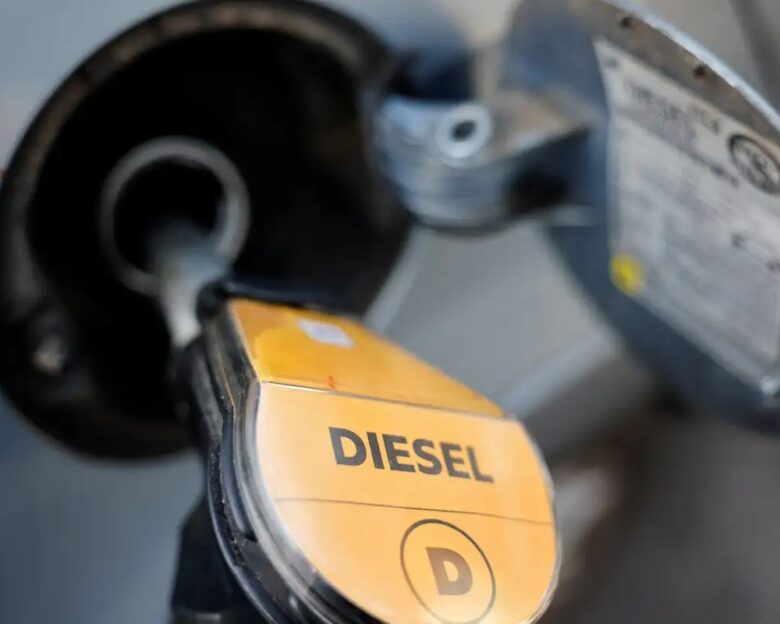 A fuel nozzle refuels a vehicle at a gas station as the German government's tax cut on fuel comes into effect, in Berlin, Germany, October 01, 2026