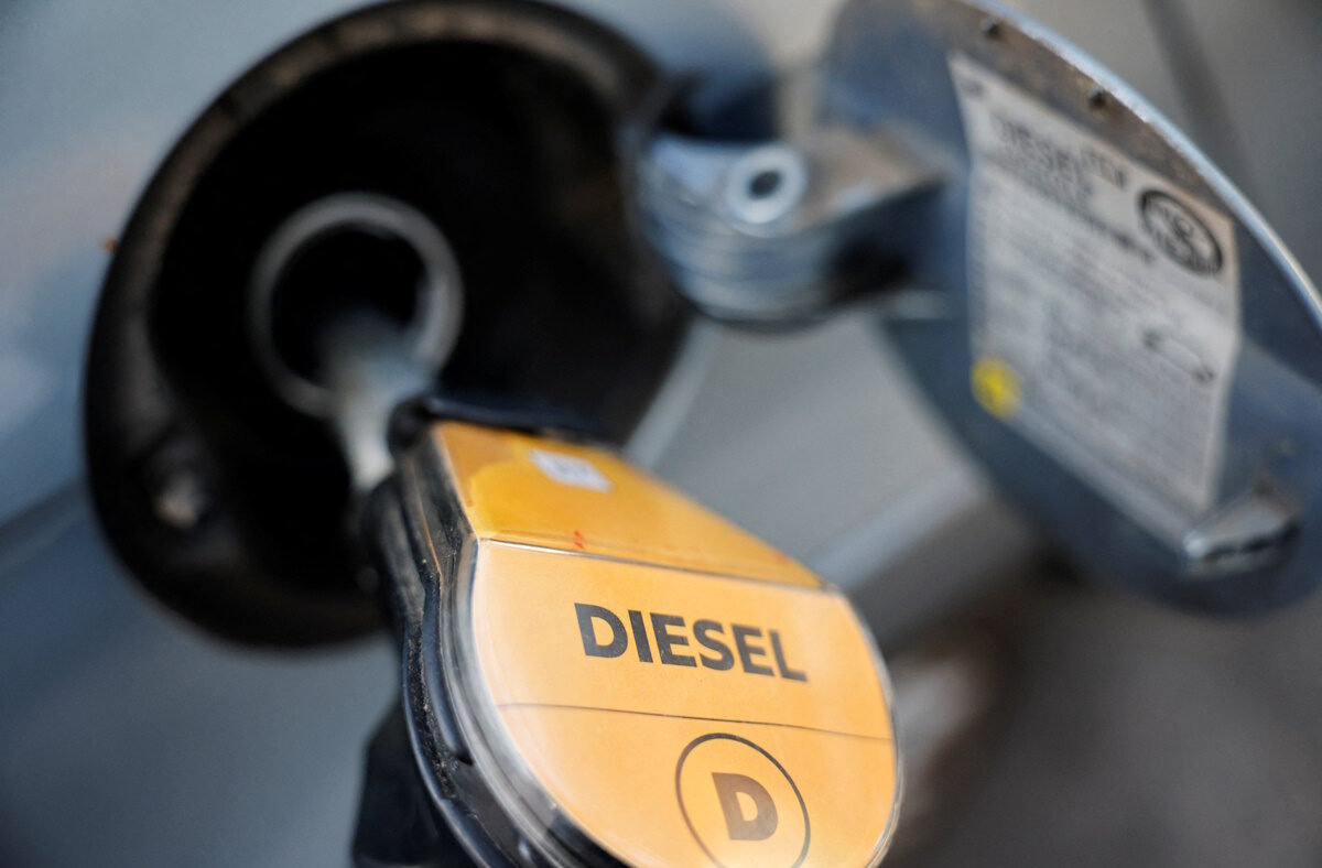 A fuel nozzle refuels a vehicle at a gas station as the German government's tax cut on fuel comes into effect, in Berlin, Germany, October 01, 2026