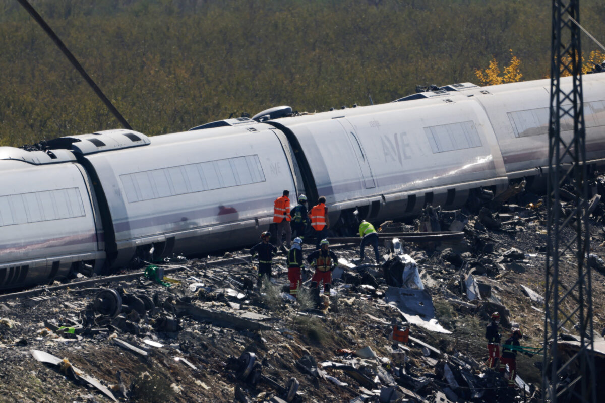 Rescue personnel work at the site of the collision of two high-speed trains between the towns of Mora and Orgaz, near Toledo, Spain, October 28, 2026. REUTERS
