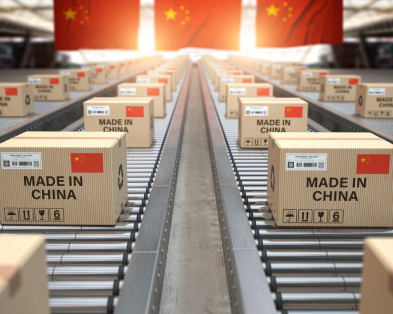 Made in China. Cardboard boxes with text made in China and chinese flag on the roller conveyor. 3d illustration