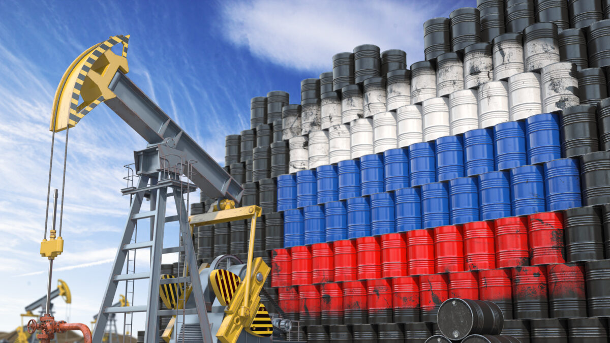 Oil production and extraction in Russia. Oil pump jack and oil barrels with Russia flag. 3d illustration