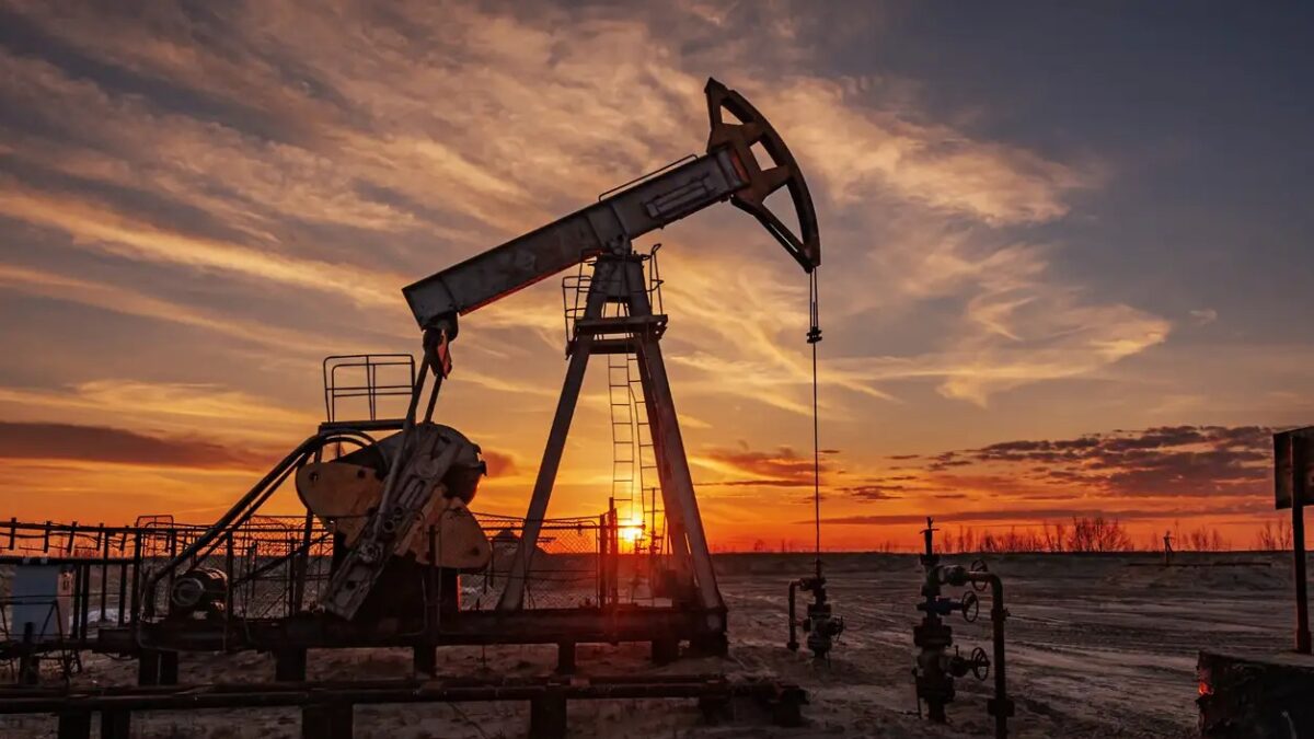 Oil pump rig. Oil and gas production. Oilfield site. Pump Jack are running. Drilling derricks for fossil fuels output and crude oil production. War on oil prices. Global coronavirus COVID 19 crisis.