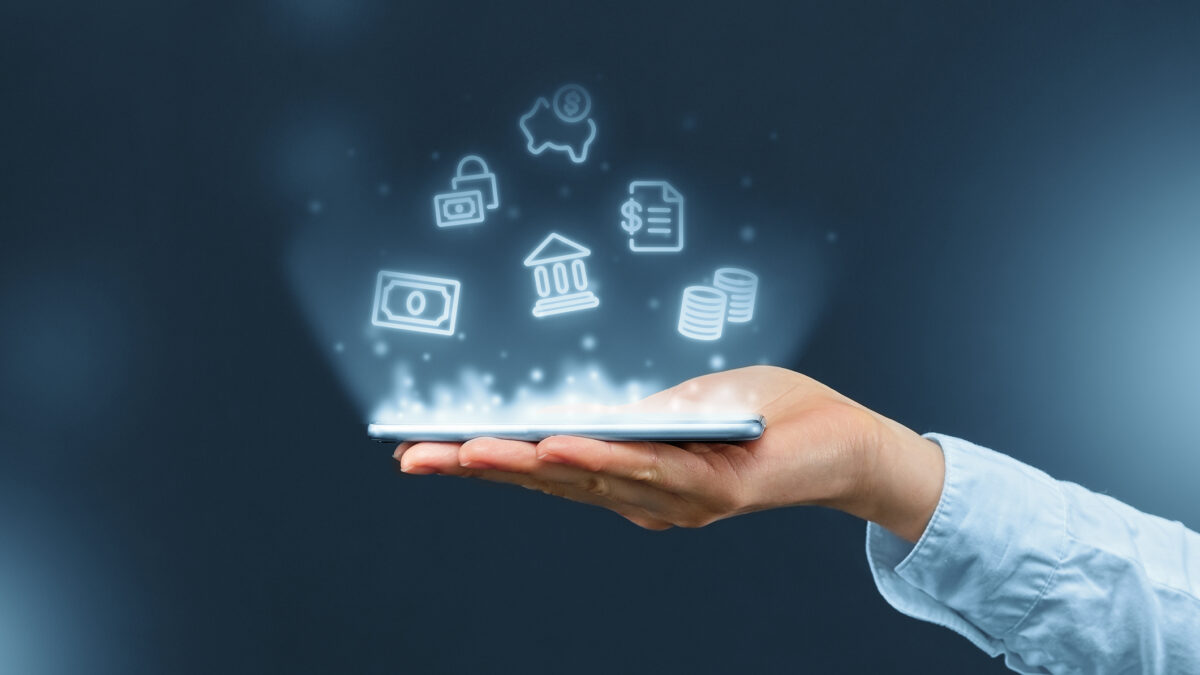 Person holds a smartphone with mobile banking icons projection
