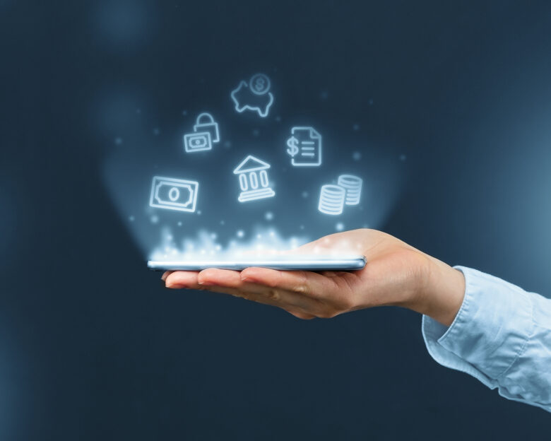 Person holds a smartphone with mobile banking icons projection