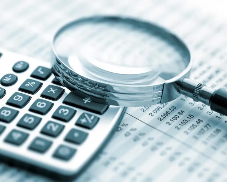 Magnifying glass on financial chart