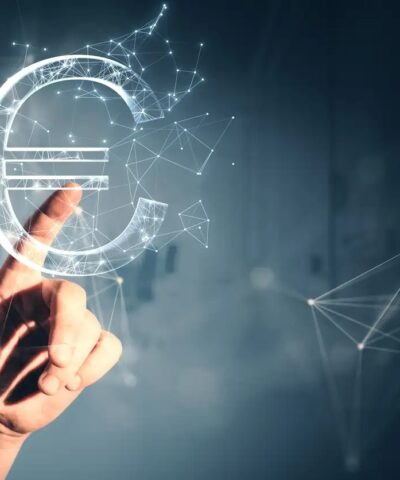 Close up of male hand pointing at creative polygonal euro sign on gray wall background. Online banking, money and trade concept