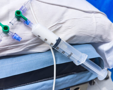Medical vials, syringes, and needles representing hospital drugs and medications for anesthesia and sedation in healthcare settings