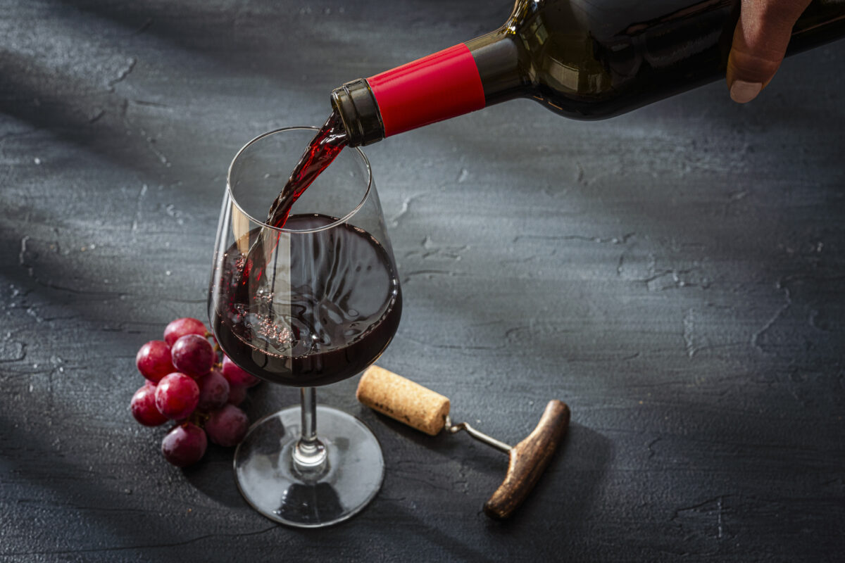 Puoring red wine into a wineglass