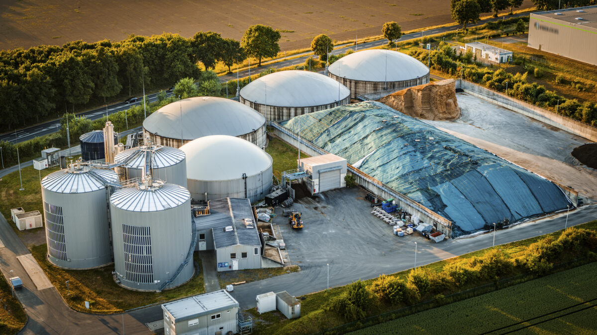 Aerial view of a biogas Plant Facility Transforming Organic Waste Into Eco Friendly Renewable Energy Source. Shot in North Rhine Westphalia, Germany - Europe