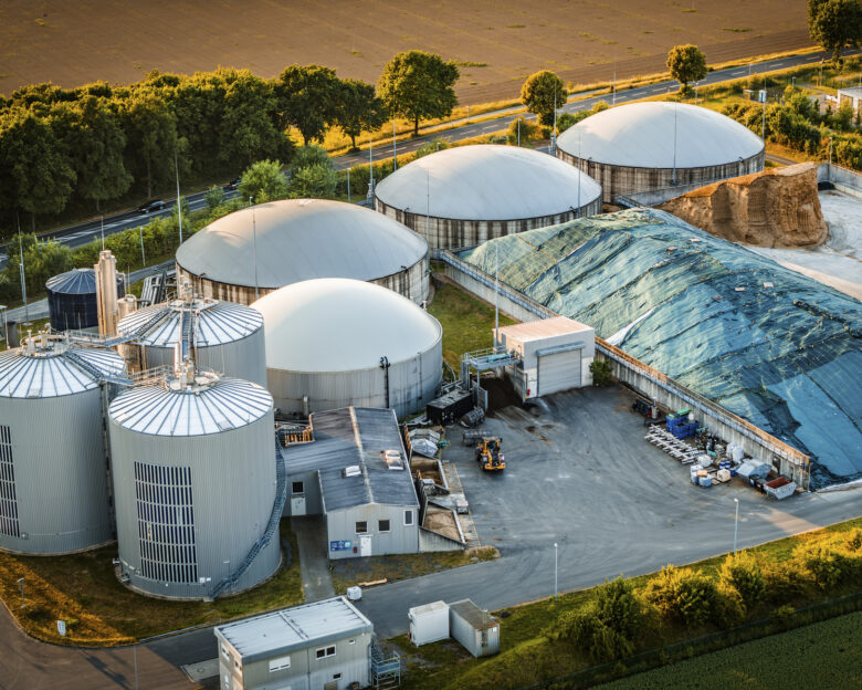 Aerial view of a biogas Plant Facility Transforming Organic Waste Into Eco Friendly Renewable Energy Source. Shot in North Rhine Westphalia, Germany - Europe