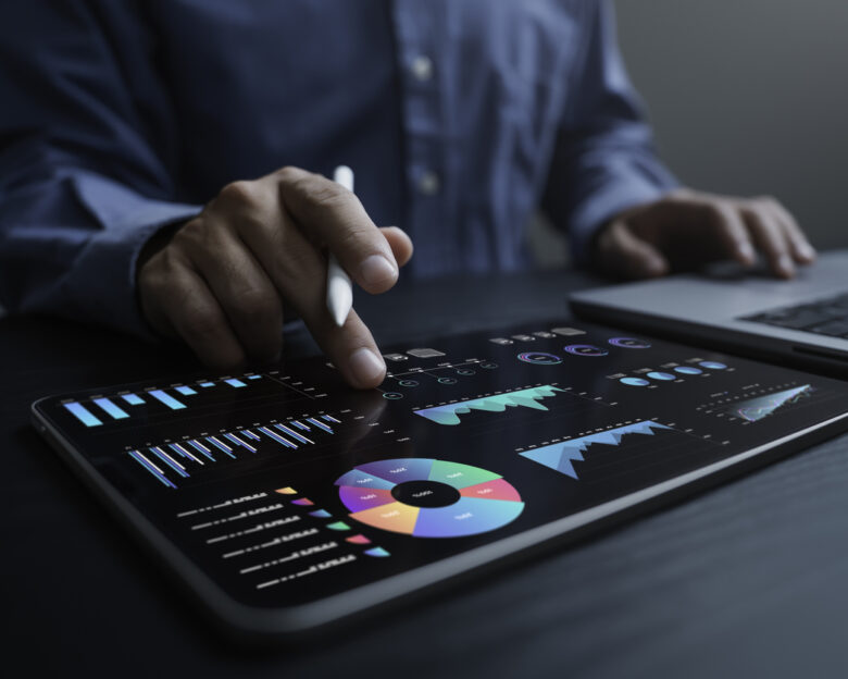 An analyst uses a computer and dashboard for data business analysis and Data Management System with KPI and metrics connected to the database for technology finance, operations, sales, marketing