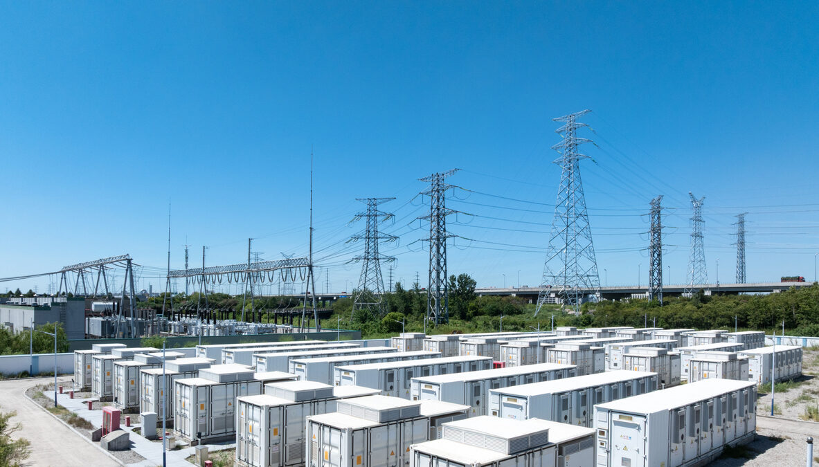 Aerial view of battery energy storage systems under a clear blue sky